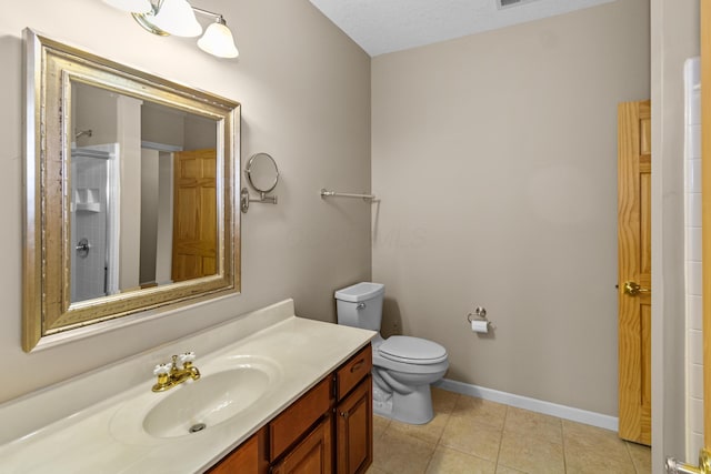 full bathroom featuring walk in shower, baseboards, toilet, tile patterned floors, and vanity
