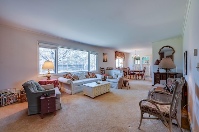 living room featuring ornamental molding, a chandelier, and light carpet