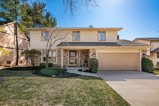 traditional home with roof with shingles, concrete driveway, a front lawn, a garage, and brick siding