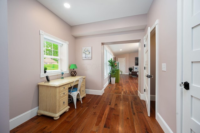 office space with dark wood-type flooring, recessed lighting, baseboards, and lofted ceiling