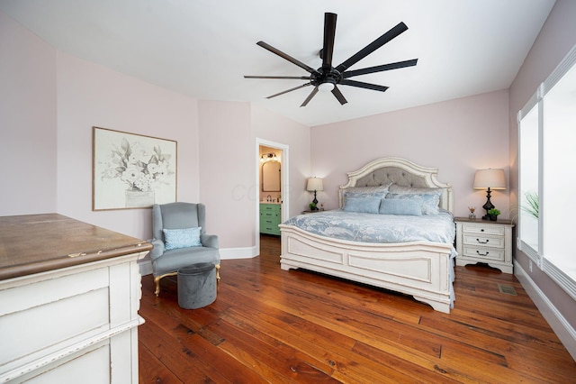 bedroom featuring visible vents, ceiling fan, baseboards, and hardwood / wood-style floors