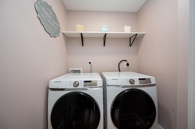 washroom with laundry area and separate washer and dryer