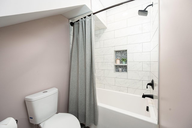 bathroom featuring toilet and shower / bath combo