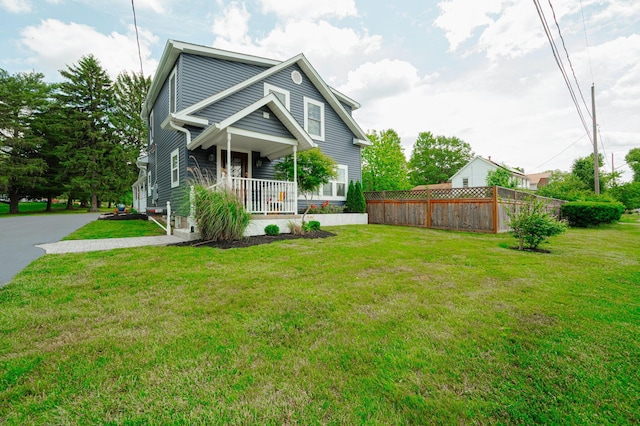 view of front of property featuring a porch and a front lawn