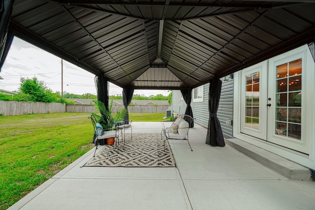 view of patio / terrace with a gazebo, french doors, and fence