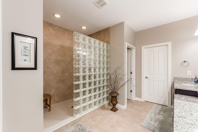 full bathroom with tile patterned floors, visible vents, recessed lighting, baseboards, and walk in shower