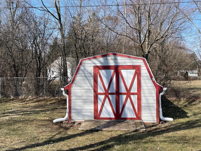 view of shed with a fenced backyard