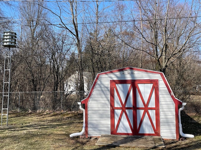 view of shed with fence