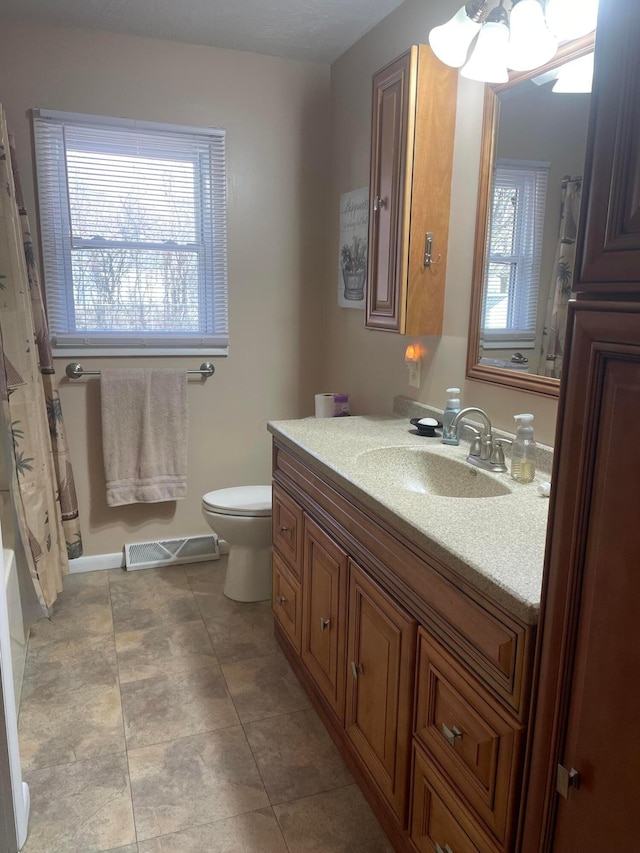 full bath featuring visible vents, toilet, and vanity