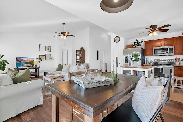 dining area with lofted ceiling, dark wood-type flooring, and a ceiling fan