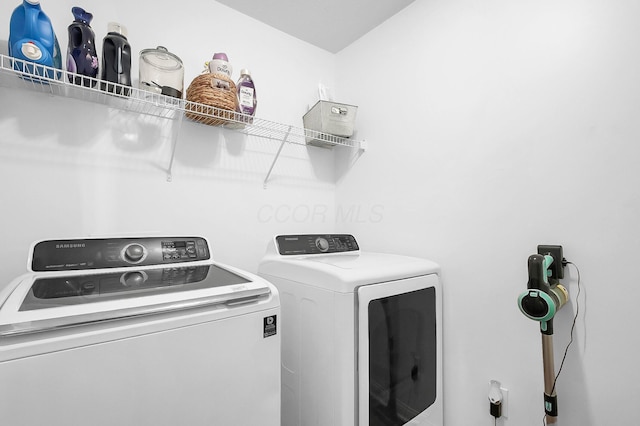 laundry room with independent washer and dryer and laundry area