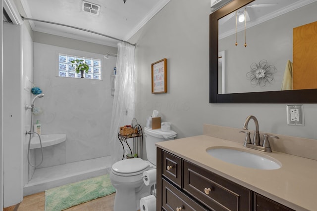 bathroom featuring visible vents, toilet, a shower with shower curtain, ornamental molding, and vanity