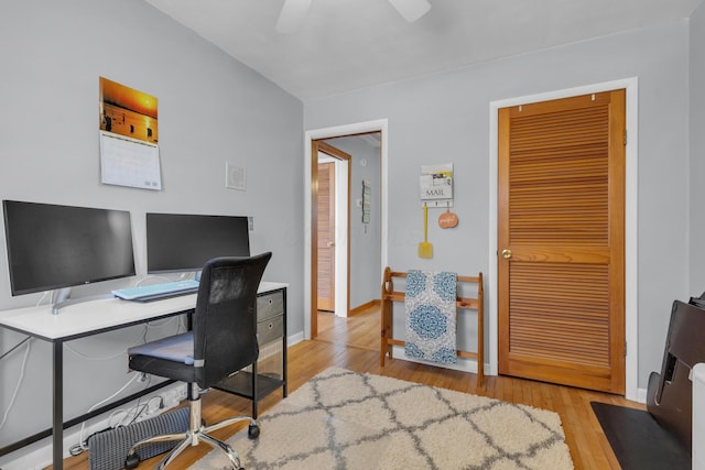 office space with ceiling fan, baseboards, and wood finished floors