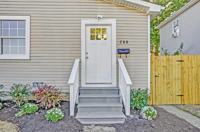 doorway to property with fence