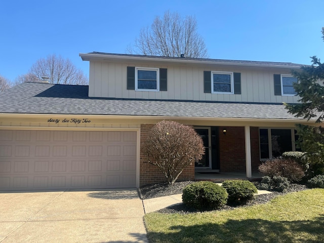 traditional-style house with covered porch, concrete driveway, an attached garage, a shingled roof, and brick siding