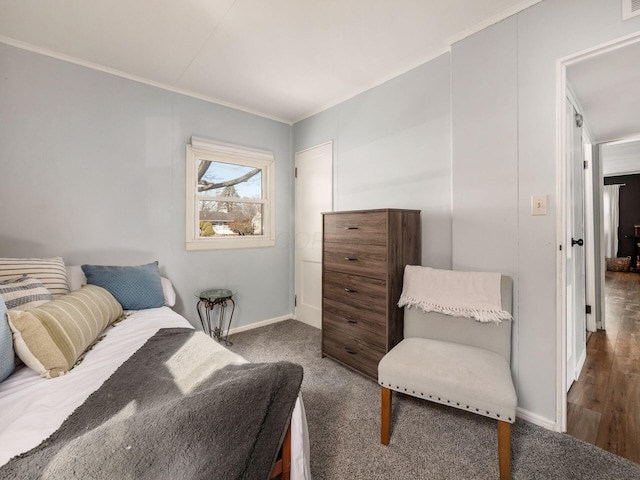 bedroom featuring crown molding, carpet flooring, and baseboards