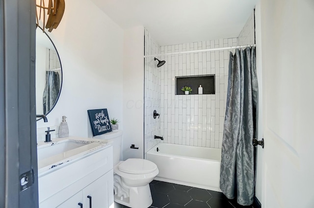 full bath with tile patterned floors, shower / tub combo with curtain, vanity, and toilet