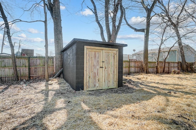 view of shed featuring a fenced backyard