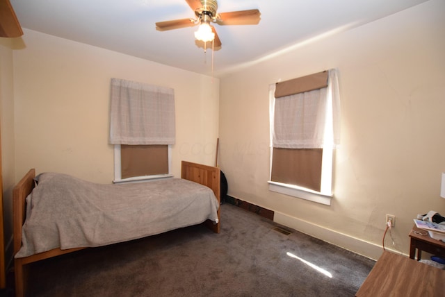 bedroom with baseboards, carpet, and a ceiling fan