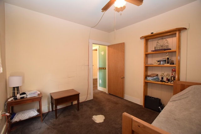 carpeted bedroom with baseboards and a ceiling fan