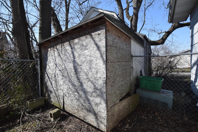 view of outdoor structure with an outbuilding and fence