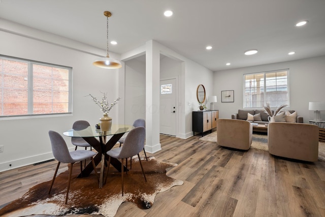 dining room featuring recessed lighting, baseboards, and wood finished floors