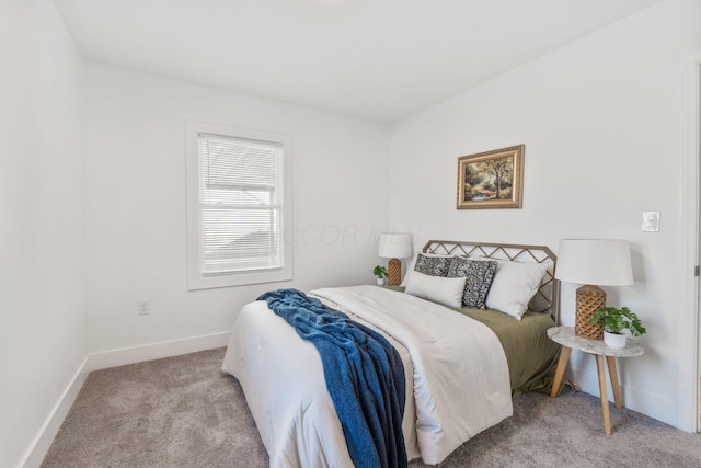 bedroom with carpet flooring and baseboards