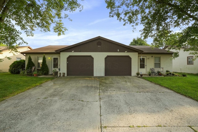 ranch-style house with driveway, a front yard, and an attached garage