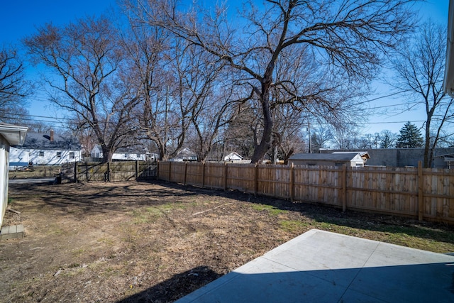 view of yard featuring a patio area and a fenced backyard