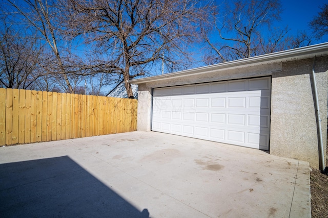 garage with fence