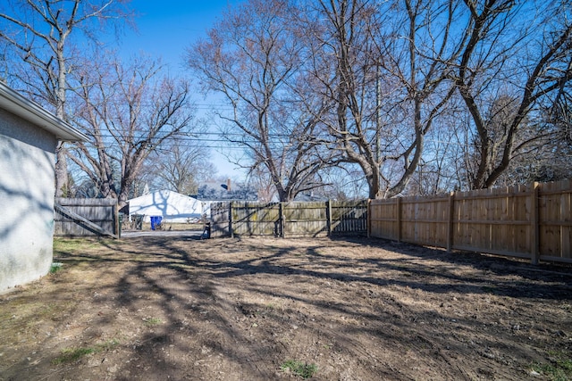 view of yard with a fenced backyard