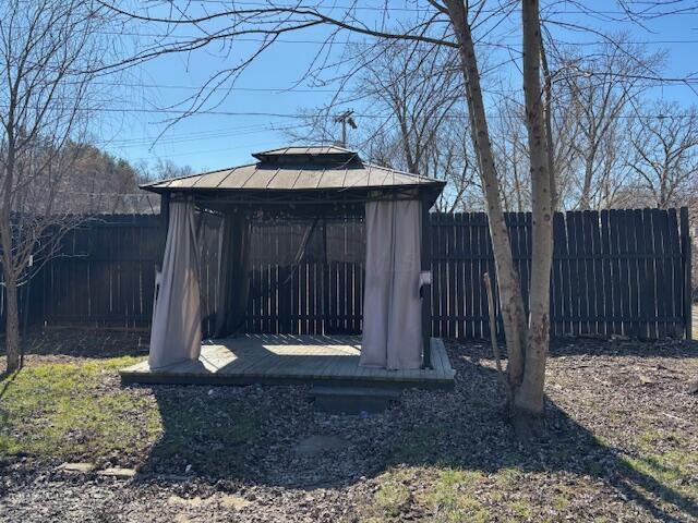 view of outbuilding featuring a gazebo and a fenced backyard