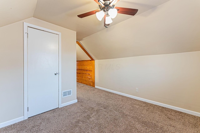 bonus room featuring visible vents, carpet flooring, baseboards, and lofted ceiling