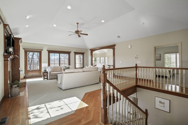 living room with recessed lighting, visible vents, lofted ceiling, and ornate columns