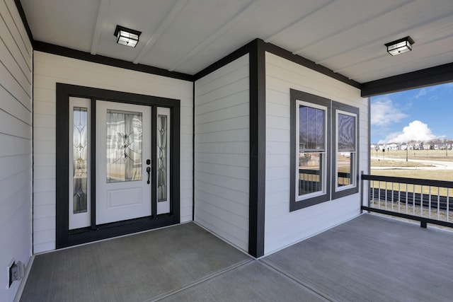 entrance to property featuring a porch