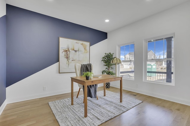 office space featuring recessed lighting, visible vents, baseboards, and wood finished floors