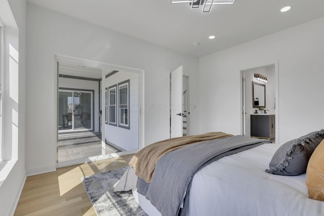 bedroom featuring recessed lighting, light wood-style flooring, and access to outside