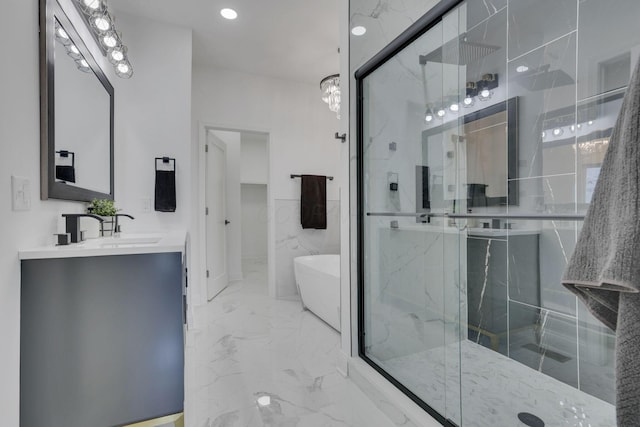 bathroom featuring vanity, a freestanding tub, marble finish floor, and a marble finish shower