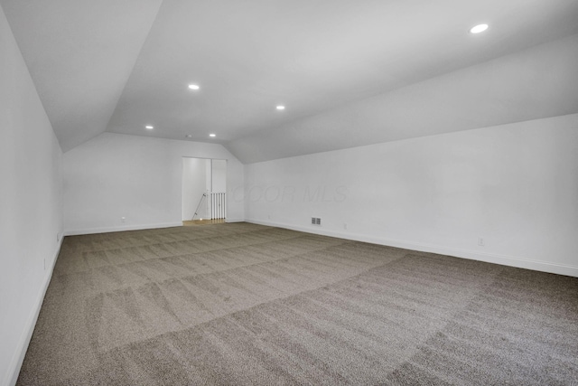 additional living space with lofted ceiling, recessed lighting, baseboards, and carpet floors