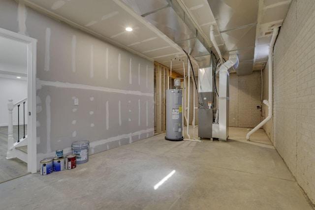 unfinished basement featuring stairs, heating unit, water heater, and brick wall