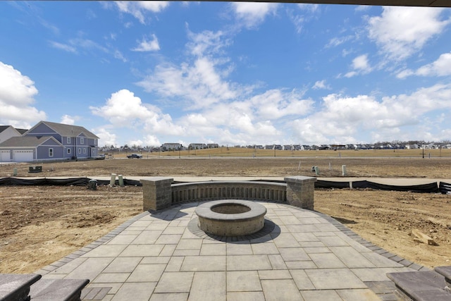 view of patio / terrace with an outdoor fire pit