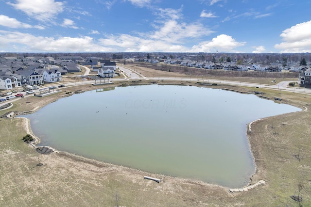 drone / aerial view with a residential view and a water view