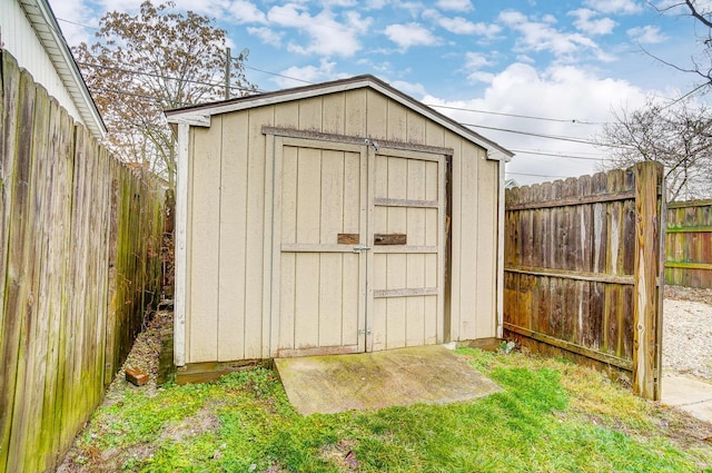 view of shed with a fenced backyard