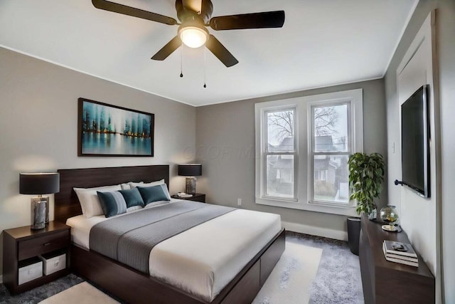 bedroom featuring carpet flooring, a ceiling fan, and baseboards