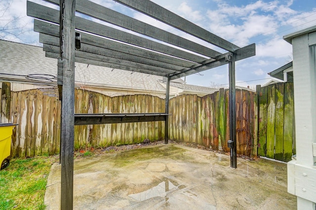 view of patio / terrace with a pergola and fence