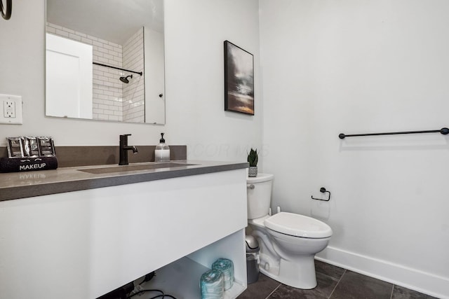 full bathroom with vanity, baseboards, walk in shower, tile patterned floors, and toilet