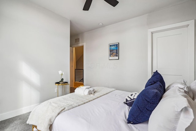 bedroom with visible vents, carpet, baseboards, and ceiling fan