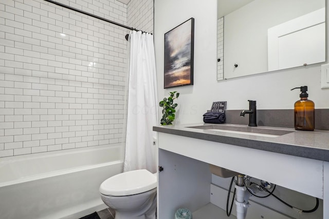 bathroom with vanity, toilet, and shower / tub combo