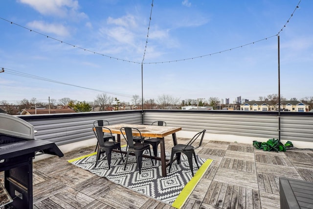 wooden deck featuring outdoor dining area