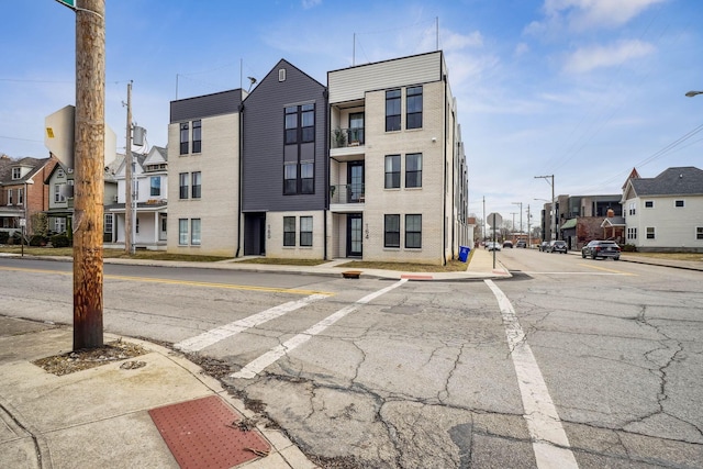 view of building exterior with a residential view